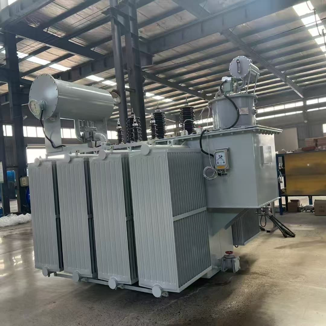Oil-immersed transformer with radiator banks, a conservator and an on-load tap-changer compartment, in the factory hall